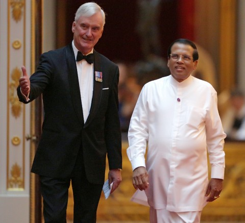 Sri Lanka's President Maithripala Sirisena (R) arrives to attend The Queen's Dinner during The Commonwealth Heads of Government Meeting (CHOGM), at Buckingham Palace in London on April 19, 2018.
Britain's Queen Elizabeth II, accompanied by Britain's Prince Charles, Prince of Wales, will receive Commonwealth Heads of Government and their spouses in the Blue Drawing Room, where the evening commences with a drinks reception. The dinner will take place in the Picture Gallery where Her Majesty will give a speech. / AFP PHOTO / POOL / Daniel LEAL-OLIVAS