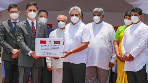 President-receives-stock-of-COVID-19-vaccine-donated-by-China-at-BIA